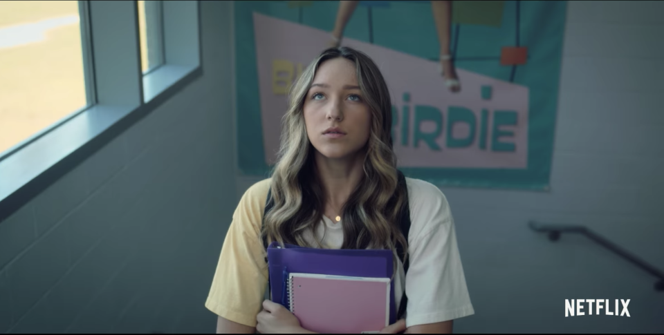 Jodi looking up at a poster of herself in "Bye Bye Birdie"