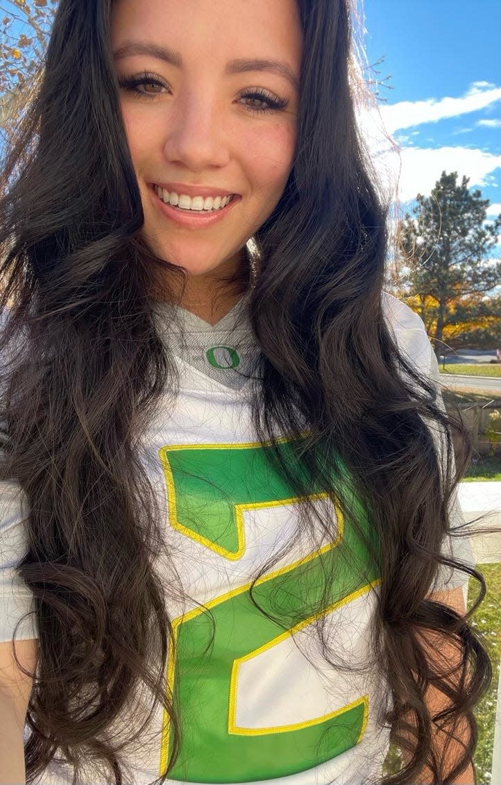 Emily Abellon wearing her Oregon Ducks jersey