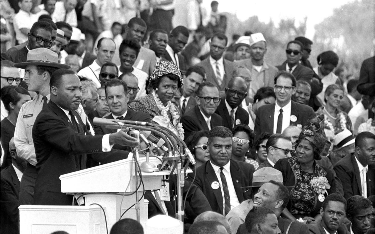 Martin Luther King speaks in 1963 in front of the Lincoln Memorial in Washington, DC - AP