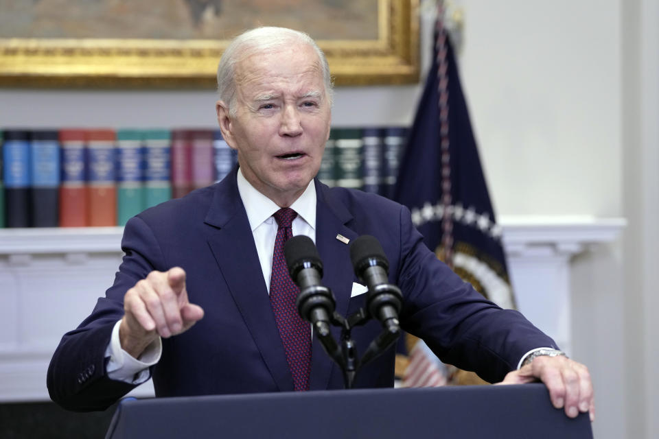 President Biden speaks at a podium at the White House.