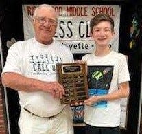 Ridgewood Chess Club adviser Terry Guilliams honors Noah Smoulder for winning the spring open over Jackson Grimmett in a best of three series. The son of Jessie and Angie Smoulder of West Lafayette won two games to one. His name will be added to the spring open championship plaque.