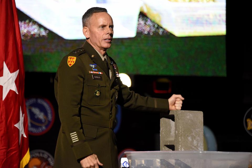 Lt. Gen. Daniel L. Karbler, U.S. Army Space and Missile Defense Command commanding general, speaks to scouts about facing adversity through a demonstration using water, a brick, pebbles and sand at the Greater Alabama Council, Boy Scouts of America, 25th anniversary banquet at the Davidson Center for Space Exploration on Nov. 11, 2023.