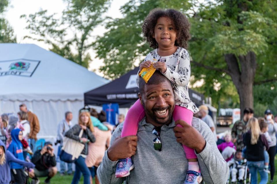 father and daughter at a festival