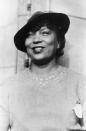 <p>Literary Icon, Harlem Renaissance writer, and anthropologist Zora Neale Hurston was born in Alabama, but was raised in Eatonville, Florida, one of the first all-Black towns incorporated in the US. Eatonville became a frequent “character” in her stories, including her most known novel <em>Their Eyes Were Watching God</em>. She is considered one of the most central writers of The Harlem Renaissance, but most of her work did not gain public attention until after her death.</p>