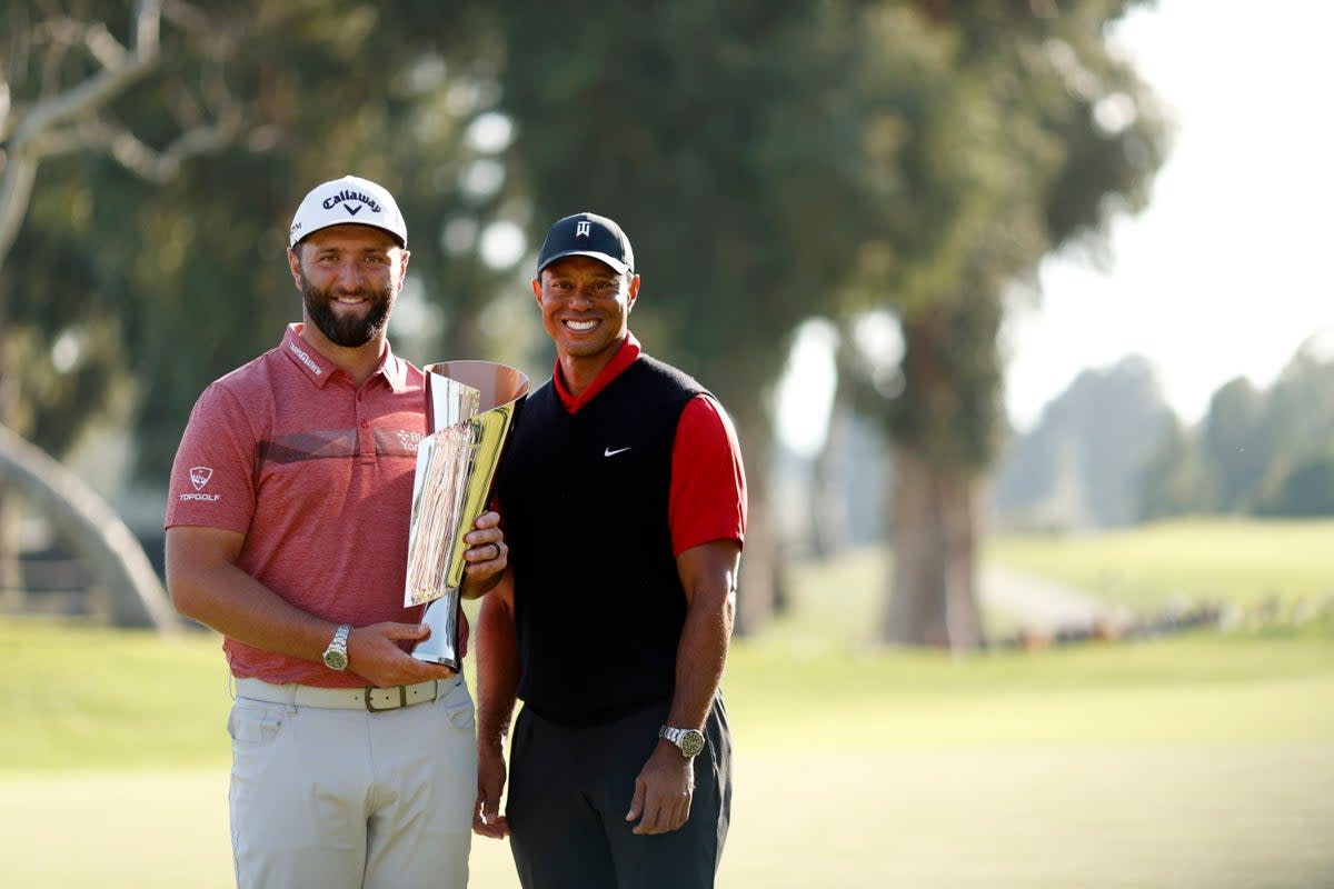 Tiger Woods presents Jon Rahm with the Genesis Invitational trophy (Getty Images)