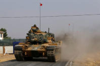 Turkish army tanks drive towards to the border in Karkamis on the Turkish-Syrian border in the southeastern Gaziantep province, Turkey, August 25, 2016. REUTERS/Umit Bektas