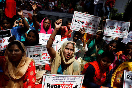 Women shout slogans during a protest organised by the Delhi Commission for Women against the rape of an eight-year-old girl, in Kathua, near Jammu and a teenager in Unnao, Uttar Pradesh state, in New Delhi, India April 13, 2018. REUTERS/Saumya Khandelwal