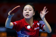 "Clap your hands and say yeah!" <br> LONDON, ENGLAND - JULY 28: Lily Zhang of the United States plays a forehand against Cornelia Molnar of Croatia during their Women's Singles Table Tennis match on Day 1 of the London 2012 Olympic Games at ExCeL on July 28, 2012 in London, England. (Photo by Feng Li/Getty Images)