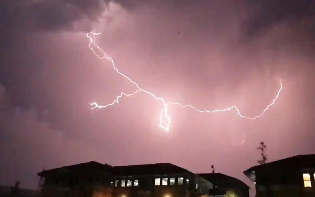 The Met Office has said rain and thunderstorms will persist in the southern half of Britain on Sunday