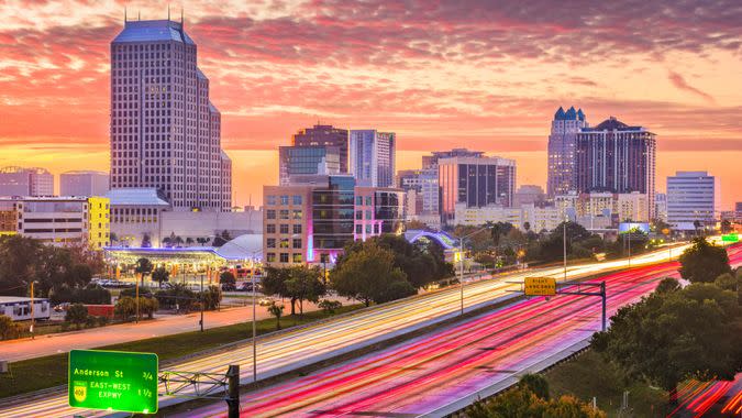 Orlando, Florida, USA downtown cityscape over the highway.