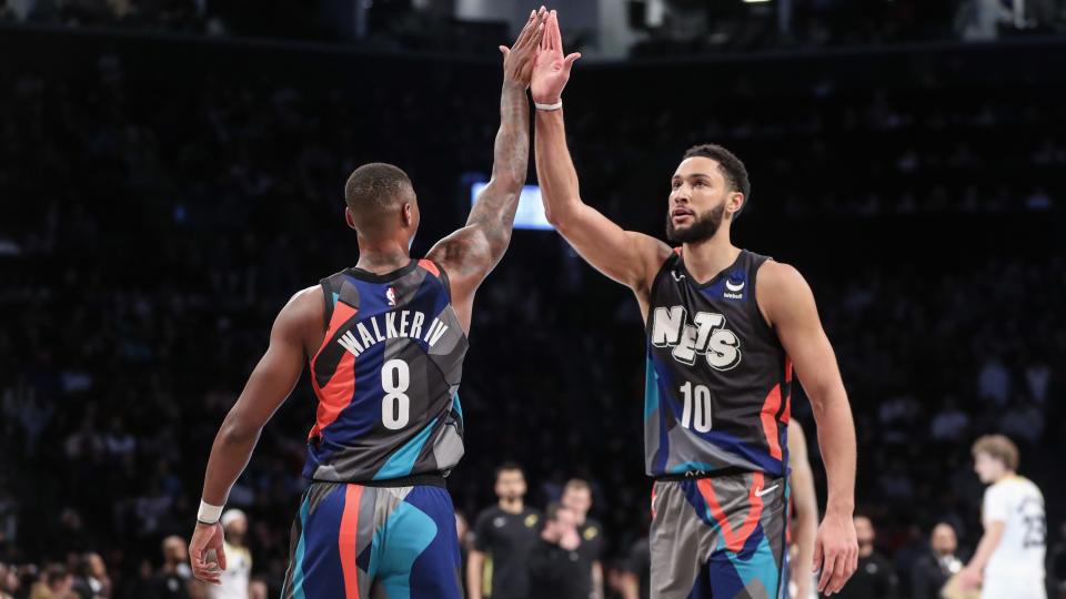 Jan 29, 2024; Brooklyn, New York, USA; Brooklyn Nets guard Lonnie Walker IV (8) greets guard Ben Simmons (10) during a timeout in the third quarter against the Utah Jazz at Barclays Center. Mandatory Credit: Wendell Cruz-USA TODAY Sports