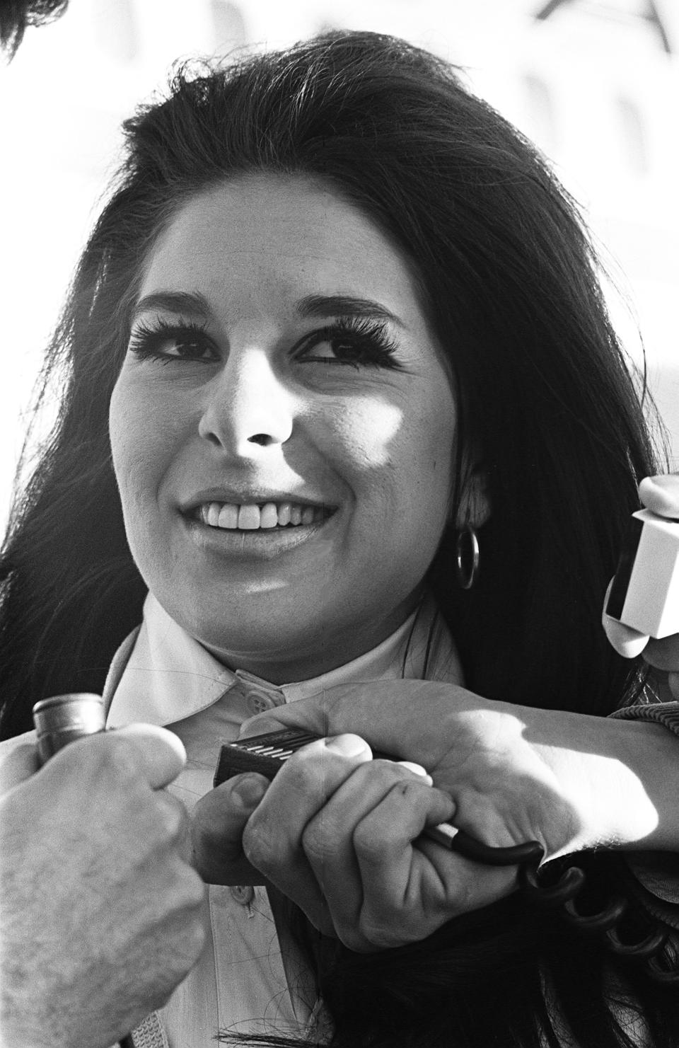 Singer Bobbie Gentry talks to reporters outside the Nashville airport in 1967.