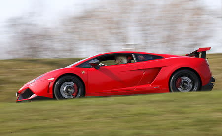 Sonja Heiniger, 76 years old, drives her Lamborghini in Jona, Switzerland, March 20, 2015. REUTERS/Alessandro Garofalo