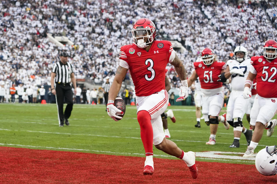 FILE - Utah running back Ja'Quinden Jackson (3) scores a touchdown during the first half in the Rose Bowl NCAA college football game against Penn State, Monday, Jan. 2, 2023, in Pasadena, Calif. Utah opens their season at home against Florida on Aug. 31. (AP Photo/Marcio Jose Sanchez, FIle)