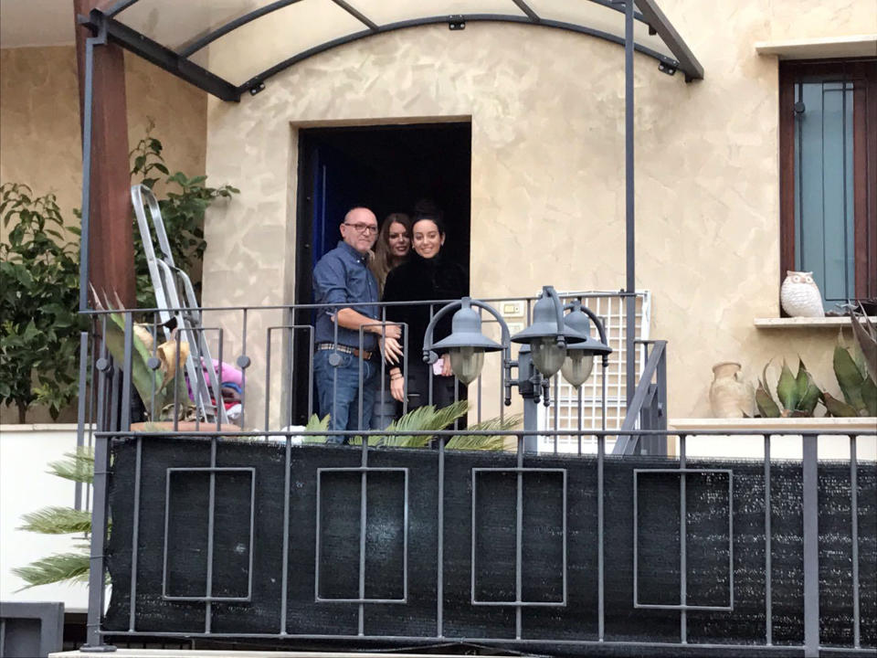 Avalanche survivor Giorgia Galassi, wearing black at right, smiles with her parents mother Isa Toccotelli, center, and Tomasso Galassi, at their home in Giulianova, Italy, Monday, Jan. 23, 2017. Galassi and her boyfriend Vincenzo Forti were at the Hotel Rigopiano when the avalanche buried the hotel on Jan. 18 and were rescued three days later. (AP Photo/Colleen Barry)