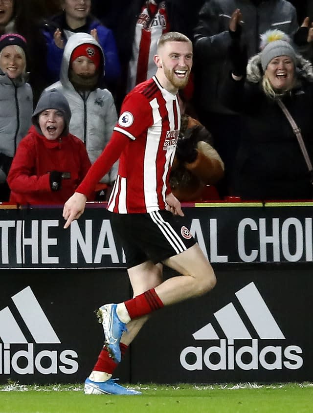 Oliver McBurnie celebrates scoring his side's goal 