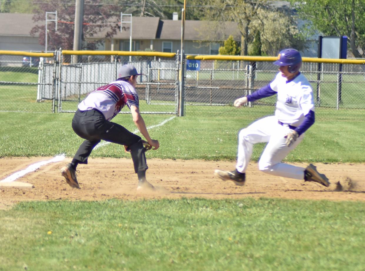 Bronson's Kestin Goodman is thrown out trying to steal third by Union City catcher Tucker Zweng. Rick Austin makes the tag for Union City