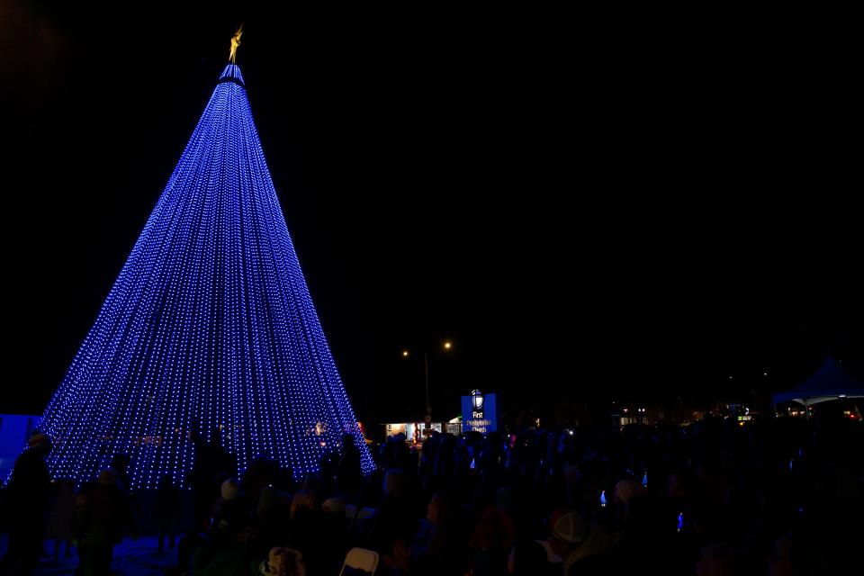 Families gathered at First Presbyterian Church in Fort Collins, Colo., on Thursday, Dec. 1, 2021, for the lighting of Realities for Children's NightLights tree. The tree is back for its 25th holiday season in Fort Collins and exists to bring awareness to issues of child abuse and neglect in Northern Colorado. It also marks Realities for Children's largest annual fundraising outreach, according to a news release from the nonprofit. The NightLights tree is made up of 30,000 programmable LED pixel light lights and will be illuminated nightly this holiday season.