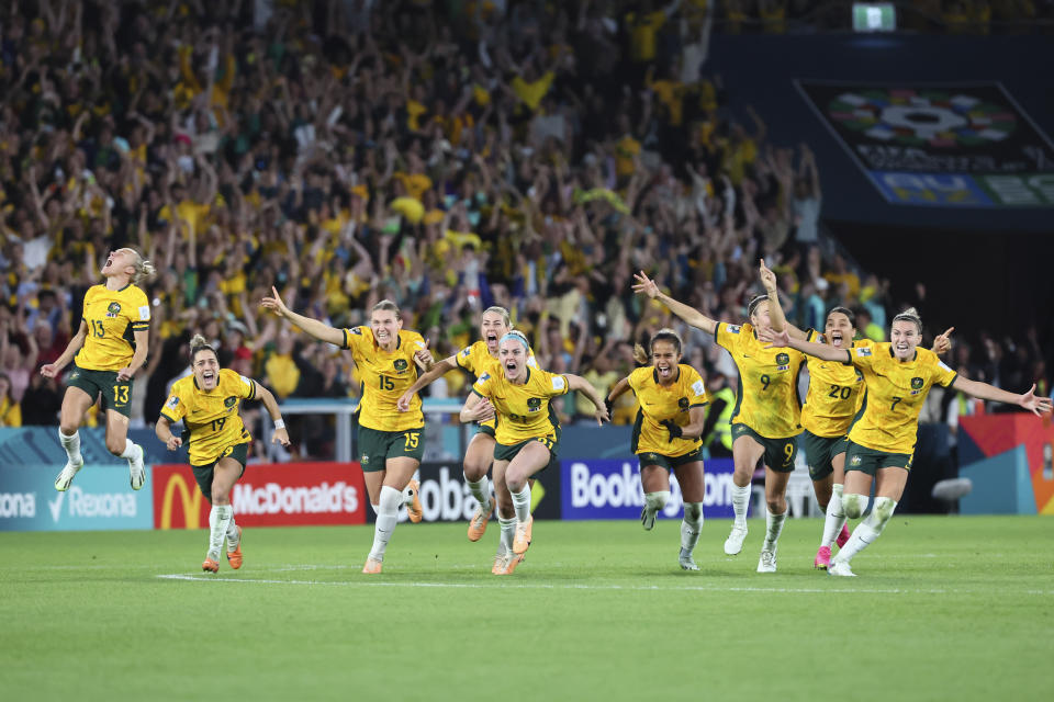 Australia players celebrate after winning the Women's World Cup quarterfinal soccer match between Australia and France in Brisbane, Australia, Saturday, Aug. 12, 2023. (AP Photo/Tertius Pickard)