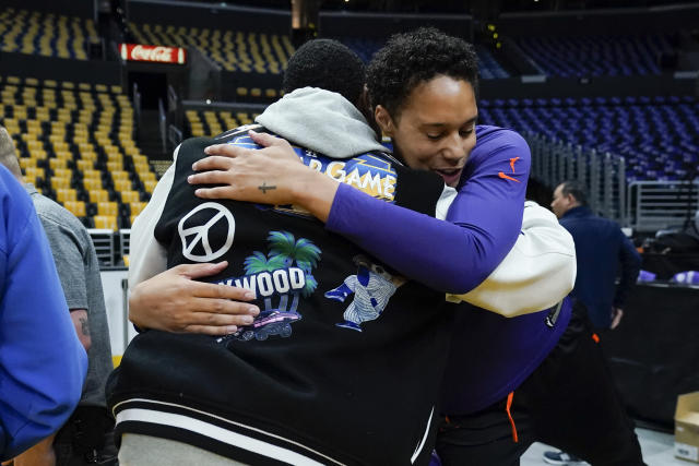 Phoenix Mercury center Brittney Griner (42) gets a hug before a WNBA basketball game against the Los Angeles Sparks in Los Angeles, Friday, May 19, 2023. (AP Photo/Ashley Landis)