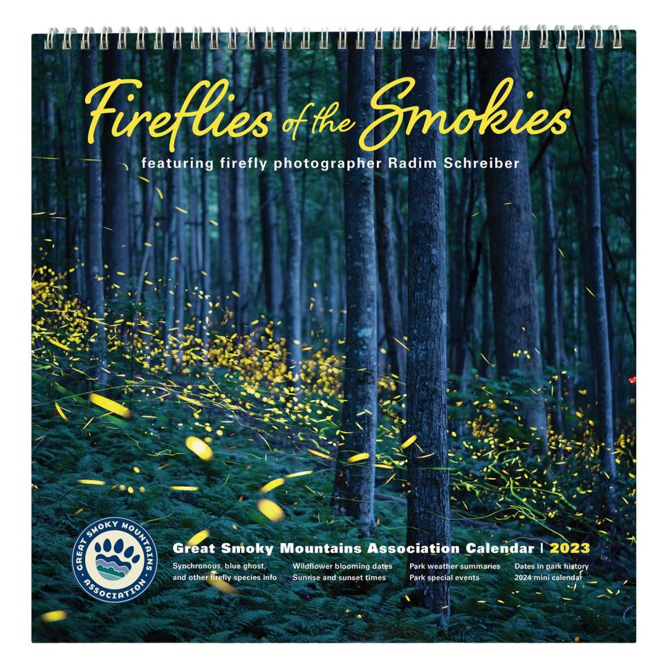 Cover of the official 2023 park calendar featuring firefly photography by Radim Schreiber and written, designed, printed, and sold by Great Smoky Mountains Association in park visitor center bookstores and online at smokiesinformation.org. Both synchronous and blue ghost fireflies can be seen in this spectacular image in Elkmont.