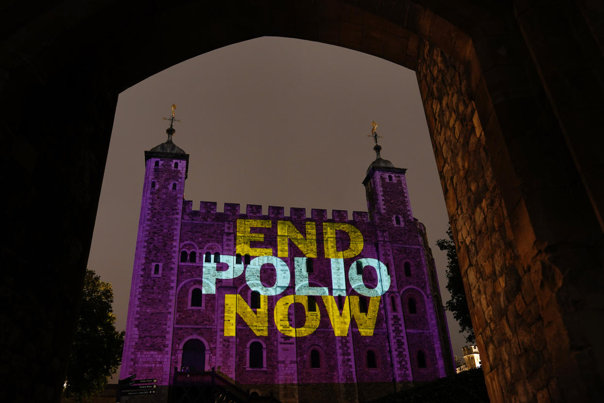 The Tower of London is lit up purple with the slogan 'End Polio Now' to mark World Polio Day. Picture date: Sunday October 24, 2021.