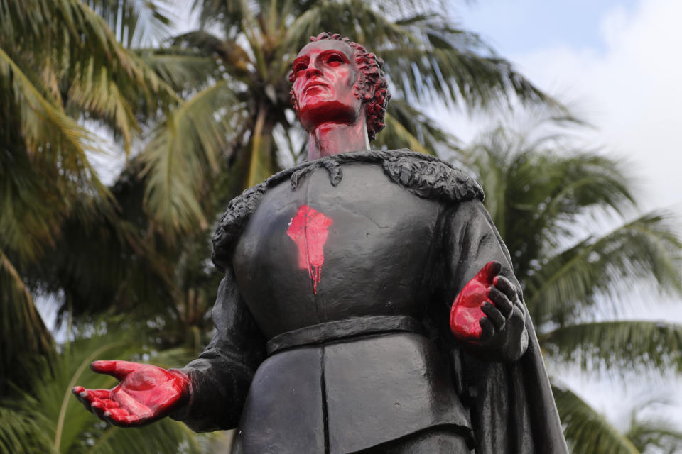 A statue of Christopher Columbus is shown vandalized at Bayfront Park in Miami, Thursday, June 11, 2020. Miami police say that several people were arrested for vandalizing the statue of Columbus and Juan Ponce de León during a protest Wednesday. Protests continue over the death of George Floyd, a black man who died last month while in police custody in Minneapolis. (AP Photo/Lynne Sladky)