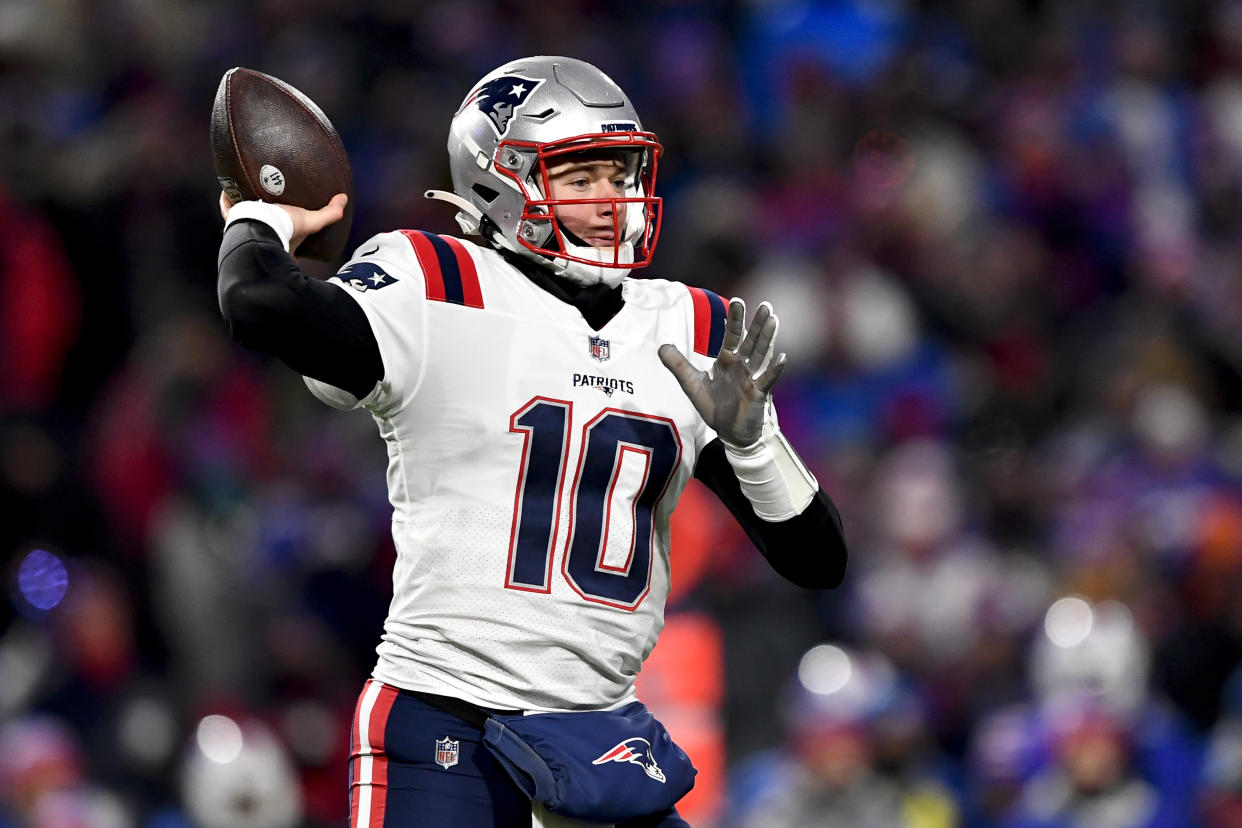 New England Patriots quarterback Mac Jones passes during the first half of an NFL wild-card playoff football game against the Buffalo Bills, Saturday, Jan. 15, 2022, in Orchard Park, N.Y. (AP Photo/Adrian Kraus)