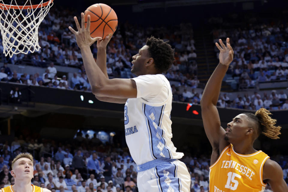 North Carolina forward Jalen Washington, center, drives against Tennessee guards Dalton Knecht, left, and Jahmai Mashack (15) during the first half of an NCAA college basketball game Wednesday, Nov. 29, 2023, in Chapel Hill, N.C. (AP Photo/Chris Seward)