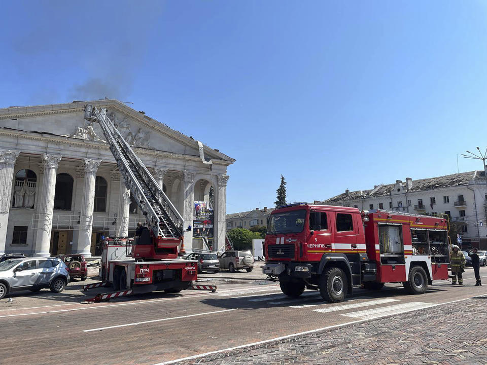 In this photo provided by the National Police of Ukraine, firefighters work at the Taras Shevchenko Chernihiv Regional Academic Music and Drama Theatre damaged by a Russian attack in Chernihiv, Ukraine, Saturday, Aug. 19, 2023. (National Police of Ukraine via AP)