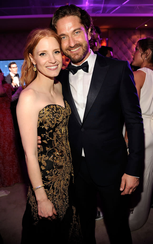 Gerard Bulter put his grubby paws on Jessica Chastain at the Vanity Fair party. She should know better than to mingle with the infamous ladies man.