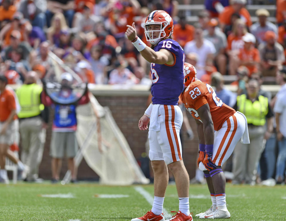 Clemson's Trevor Lawrence signals a play during Clemson's annual Orange and White NCAA college football spring scrimmage Saturday, April 6, 2019, in Clemson, S.C. (AP Photo/Richard Shiro)