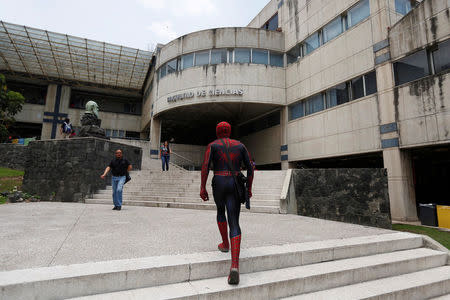 Moises Vazquez, 26, known as Spider-Moy, a computer science teaching assistant at the Faculty of Science of the National Autonomous University of Mexico (UNAM), who teaches dressed as a comic superhero Spider-Man, arrives to the university in Mexico City, Mexico, May 27, 2016. REUTERS/Edgard Garrido