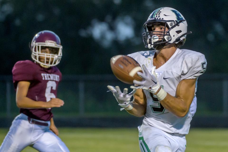 Eureka's John McDonald (5) snags a pass for a long gain against Tremont in the second quarter Friday, Sept. 2, 2022 in Tremont.