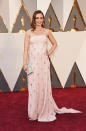 Emily Blunt shows off her adorable baby bump in this pale pink Prada number.