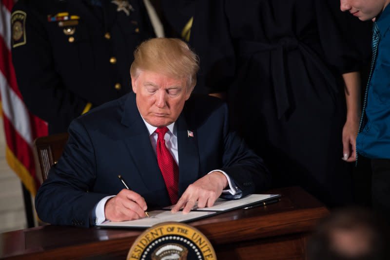 President Donald Trump signs a presidential memorandum declaring the opioid crisis a public health emergency in the East Room at the White House in Washington, D.C., on October 26, 2017. File Photo by Kevin Dietsch/UPI