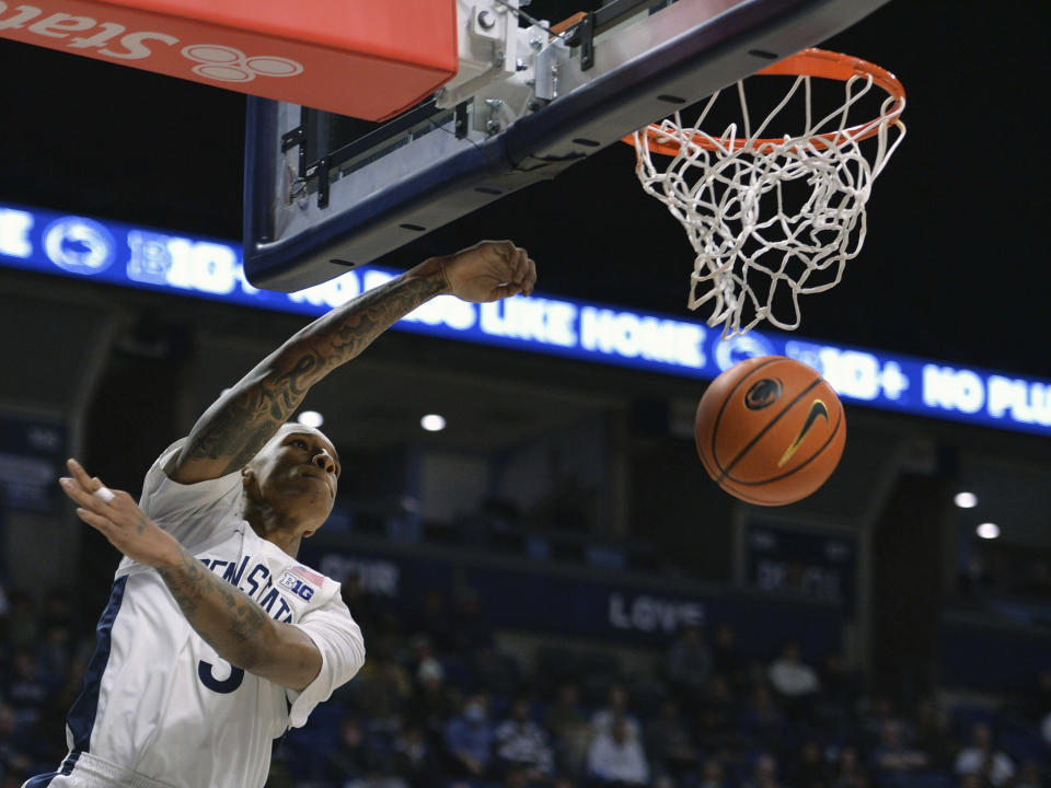 Penn State's Nick Kern Jr. dunks against Wisconsin during the first half of an NCAA college basketball game Tuesday, Jan. 16, 2024, in State College, Pa. (AP Photo/Gary M. Baranec)