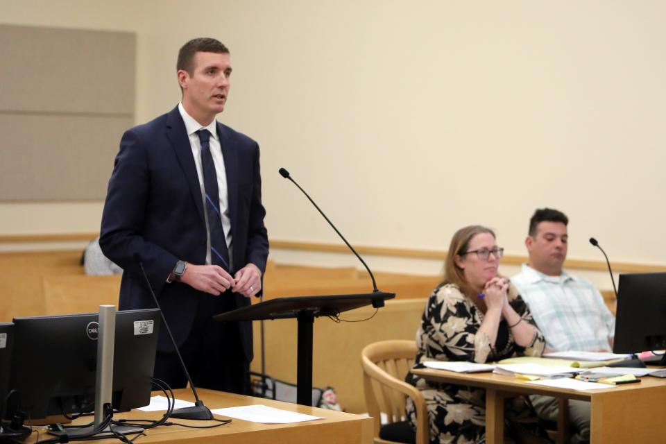 Executive Assistant District Attorney Michael Dugandzic reads his opening statement as Raymond Canario and his attorney Stefani Jordan listen on the first day of Canario's trial in Rockland County Court Feb. 27, 2023 in New City. Canario, a former building inspector, is charged with filing false documents concerning inspections for Spring Valley with the state of New York. One property included the Evergreen Court Home for Adults, where two people died in a blaze on March 22, 2021. 