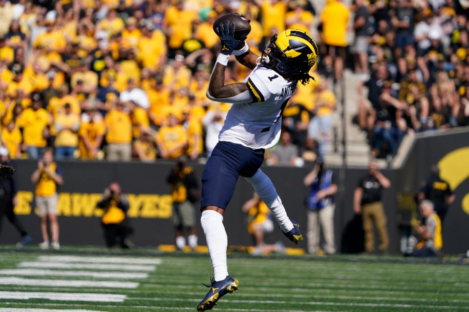 Michigan wide receiver Andrel Anthony (1) catches a pass during the first half of an NCAA college football game against Iowa, Saturday, Oct. 1, 2022, in Iowa City, Iowa. (AP Photo/Charlie Neibergall)