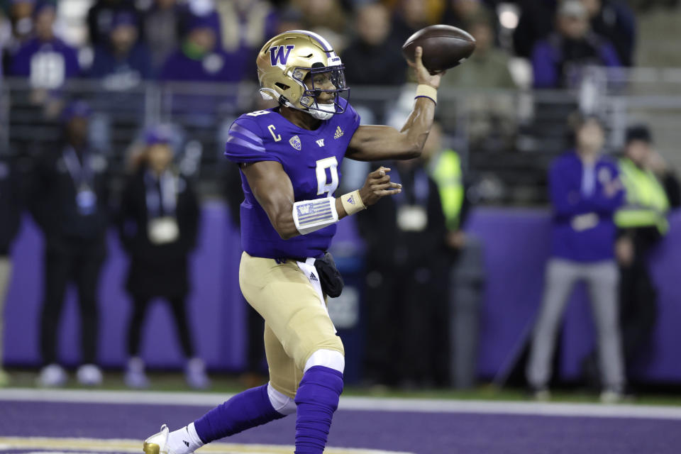 Washington quarterback Michael Penix Jr. throws a pass against Oregon State during the first half of an NCAA college football game Friday, Nov. 4, 2022, in Seattle. (AP Photo/John Froschauer)