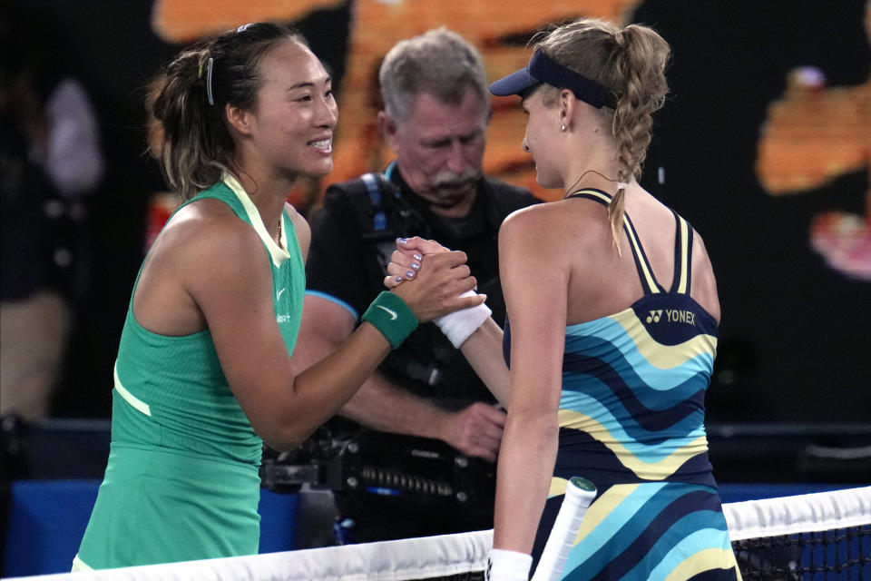 Zheng Qinwen, left, of China is congratulated by Dayana Yastremska of Ukraine following semifinal match at the Australian Open tennis championships at Melbourne Park, Melbourne, Australia, Thursday, Jan. 25, 2024. (AP Photo/Andy Wong)