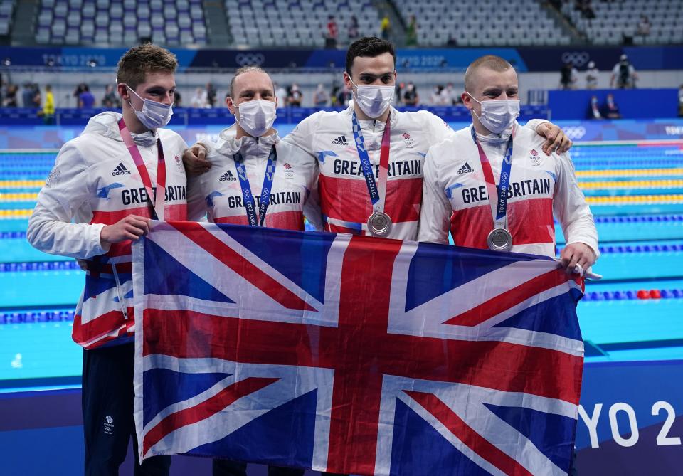 Great Britain’s (left-right) Duncan Scott, Luke Greenbank, James Guy and Adam Peaty after winning the silver medal in the men’s 4x100m medley relay (Joe Giddens/PA) (PA Wire)