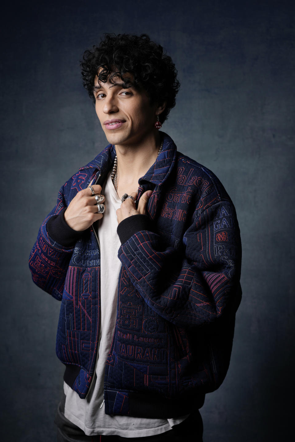 Sebastian Chacon, a cast member in the Amazon streaming miniseries "Daisy Jones and the Six," poses for a portrait at the Four Seasons Hotel, Tuesday, Feb. 21, 2023, in Los Angeles. (AP Photo/Chris Pizzello)