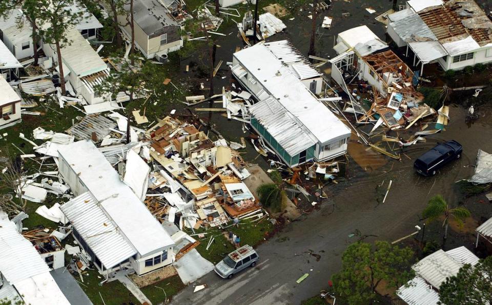 Residents surveyed the damage in Roseland, Florida. Hurricane Jeanne smashed the Treasure Coast, leaving the area crippled again only three weeks after Hurricane Frances. The area is shown Sunday, Sept. 26, 2004.