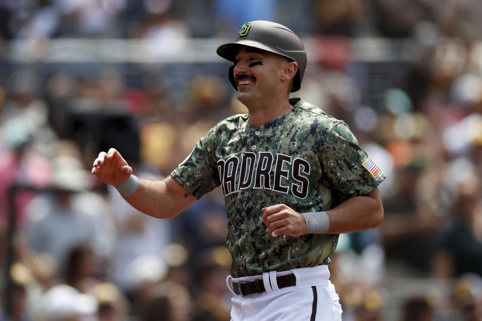 San Diego Padres' Matt Carpenter smiles after hitting a two-run home run in the third inning of a baseball game against the Boston Red Sox, Sunday, May 21, 2023, in San Diego. (AP Photo/Brandon Sloter)