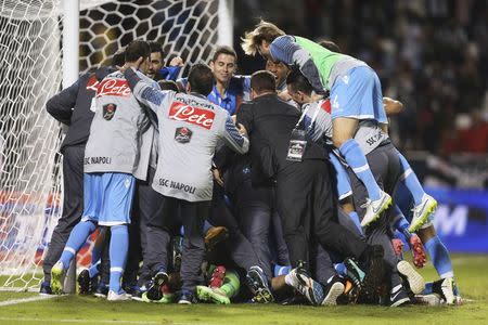 Napoli's players react after winning the penalty shoot-out during the Italian Super Cup against Juventus , at Al-Sadd Stadium, in Doha, December 22, 2014. REUTERS/Fadi Al-Assaad