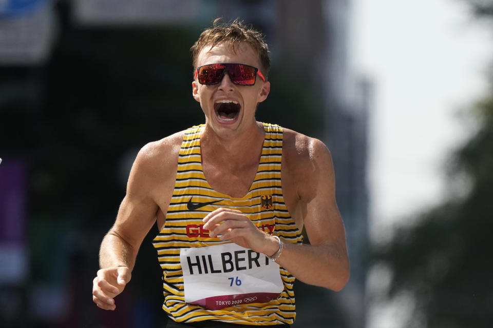 Jonathan Hilbert, of Germany, celebrates after crossing the finish line second in the men's 50km race walk at the 2020 Summer Olympics, Friday, Aug. 6, 2021, in Sapporo, Japan. (AP Photo/Shuji Kajiyama)