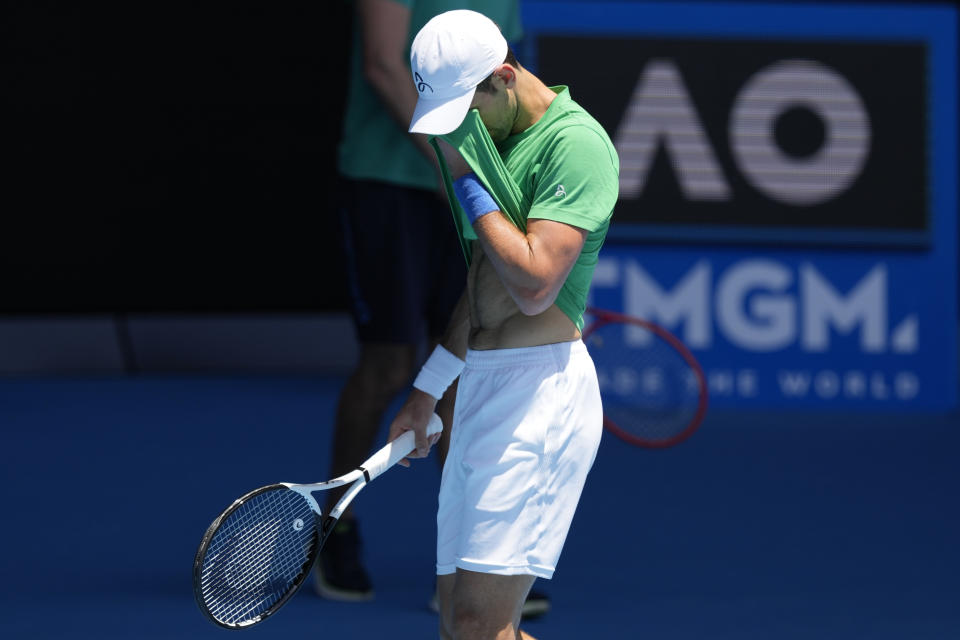 FILE - Defending men's champion Serbia's Novak Djokovic practices on Margaret Court Arena ahead of the Australian Open tennis championship in Melbourne, Australia, on Jan. 13, 2022. Tennis star Djokovic faces deportation again after the Australian government revoked his visa for a second time. Immigration Minister Alex Hawke said Friday, Jan. 14, he used his ministerial discretion to revoke the 34-year-old Serb’s visa on public interest grounds three days before the Australian Open is to begin.(AP Photo/Mark Baker, File)