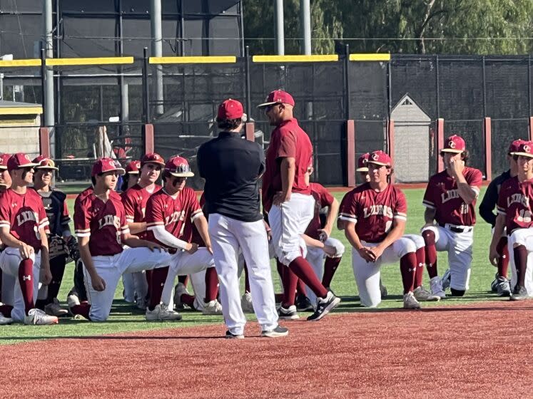 Oaks Christian coach Royce Clayton addresses his team after 4-1 win over Calabasas