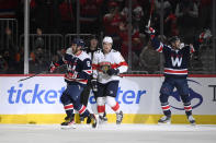 Washington Capitals left wing Alex Ovechkin (8) celebrates his second goal of the night, next to Florida Panthers defenseman Brandon Montour (62), during the second period of an NHL hockey game Friday, Nov. 26, 2021, in Washington. (AP Photo/Nick Wass)